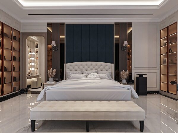 Desain Interior Kamar Tidur Utama Mewah Headboard Tufted | HnD architects Desain interior kamar tidur utama mewah dengan headboard tufted, panel biru navy, dan vanity di ceruk oleh HnD architects